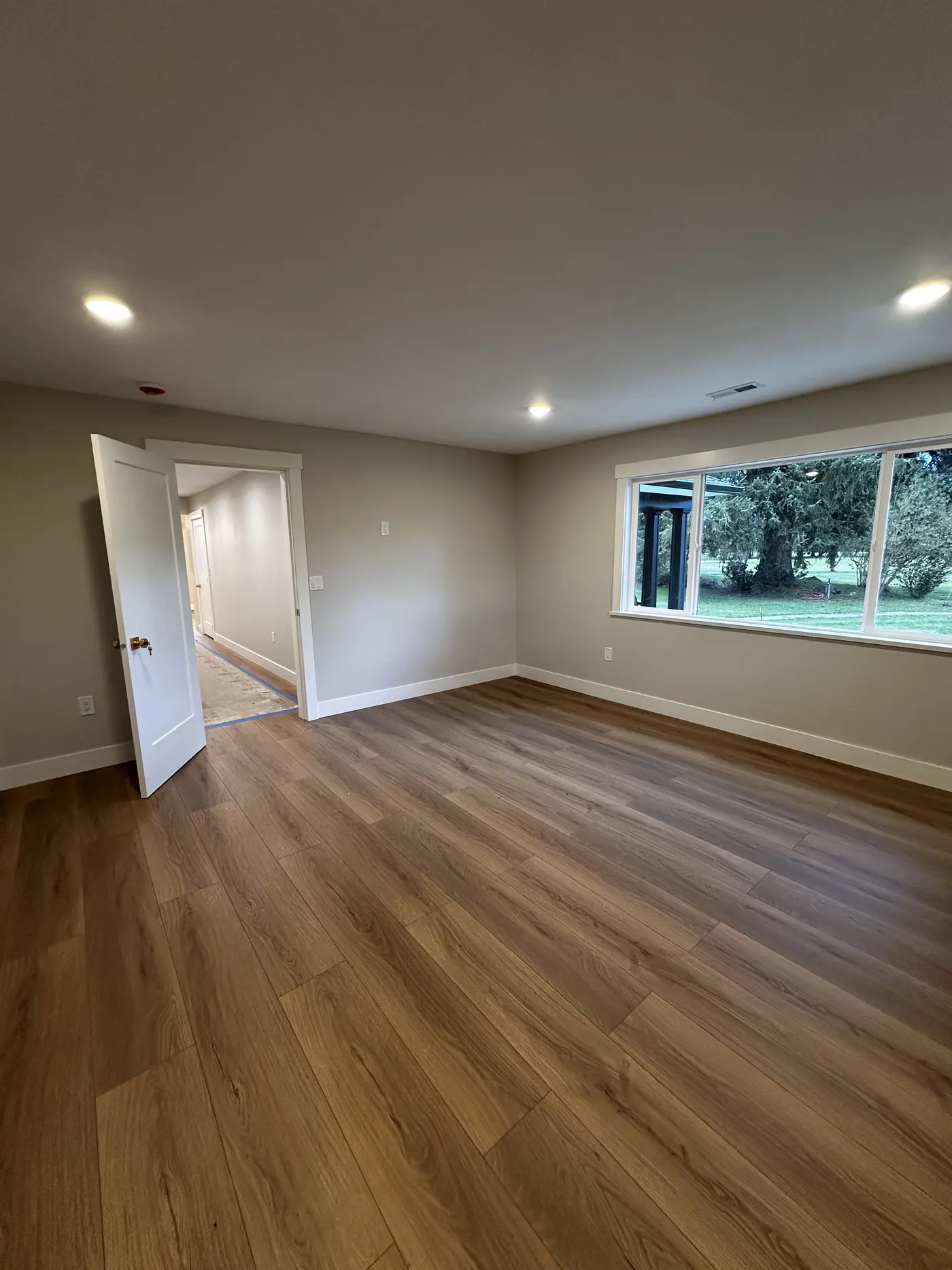 Living room with freshly painted walls and white trim — interior painting services by Joab Painting